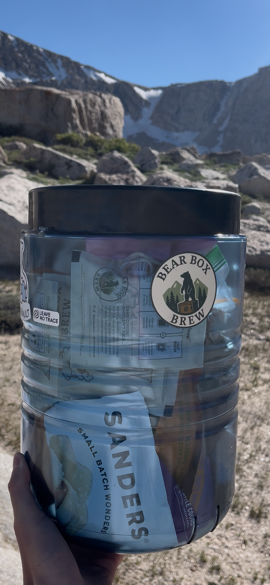 A bear box brew sticker on a bear cannister